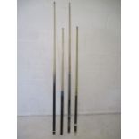 Four Snooker/Pool cues.