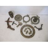 A quantity of bronze maritime items, including a porthole, section of a ships wheel etc.