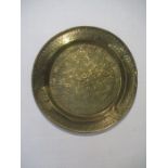 A large eastern brass tray with embossed pattern. Diameter 90cm
