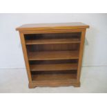 An oak freestanding bookcase, length 97cm, height 100cm.