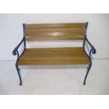 A cast iron framed garden bench, with painted ends, length 106cm.