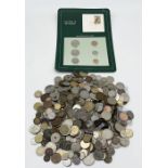 A collection of various UK and worldwide coinage including carded Solomon Islands set