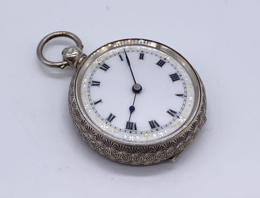 A 925 silver fob watch with white enamelled face and Roman numerals