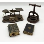 An assortment of items including vintage postage scales and weights, two gilt edged prayer books,