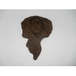 A cast iron Art Nouveau style garden wall planter, in the form of a lady.