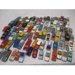 A collection of vintage play worn die-cast vehicles including Corgi Toys, Solido, Dinky Toys etc