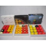 Three sets of boxed pool balls, including Aramith.