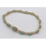 A 9ct gold bracelet set with emeralds and diamonds, total weight 8.2g