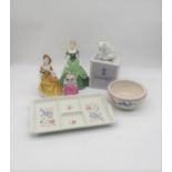 A Poole pottery bowl, along with a Poole pottery dish, a boxed Lladro polar bear and three