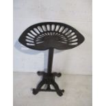 A vintage tractor seat stool