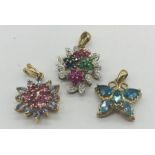 Three 9ct gold pendants set with a variety of gemstones, total weight 6.9g