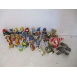 A collection of childrens novelty shampoo bottles, including some Disney, along with some soft toys,