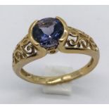 A 9ct gold amethyst ring with pierced decoration to each shoulder