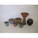 A quantity of garden pots, including some terracotta etc.