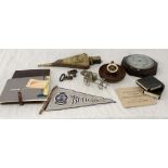 A collection of various items including ships wheel nutcracker, barometer, HMS Bulwark flag etc.