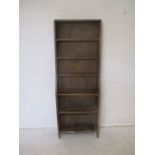 An antique oak freestanding bookcase, length 61cm, height 171cm.