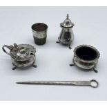 A hallmarked silver skewer, a silver plated "Just a thimble full " spirit measure etc.