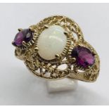 An opal and garnet 3 stone ring with filigree 9ct gold setting