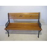 A cast iron garden bench, with wooden slatted seat, length 100cm, height 65cm