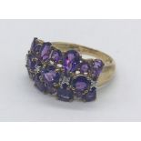 An amethyst cluster ring set in 9ct gold