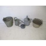 A quantity of galvanized metal items, including watering cans, buckets etc.