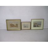 A watercolour of a coastal scene by Burker Foster, along with two other watercolours.