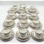 A Wellington and Foley part tea set in matched patterns including a number of trios, sugar bowl,