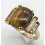 A 9ct ring set with tiger's eye and quartz