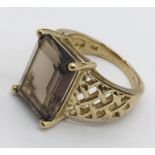 A smoky quartz 9ct gold ring