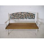 A painted cast iron garden bench, with wooden slatted seat, length 128cm.