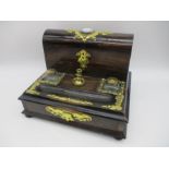 A Victorian coromandel desk set, the shaped back with hinged lid revealing space for letters with