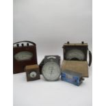 A collection of volt meters, amp meters and a Thermoscope. Makers include the Foster Instrument Co