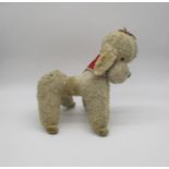 A vintage Merry Thought poodle soft toy.