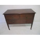 An Edwardian inlaid mahogany dressing table, on tapering legs with castors, length 107cm, height