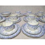 A tea set including eleven trios, a sandwich plater and creamer jug marked Nice W.A.A &Co. Plus a