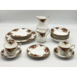 A Royal Albert Country Roses part dinner service including large milk jug, bowls, side plates etc.