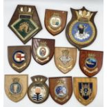 A collection of wall hung plaques, shields and crests including HMS Daealus, Falmouth, Sun Princess,