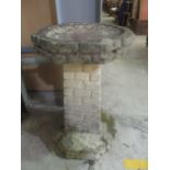 A reconstituted stone bird bath. Height 62cm