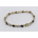A 9ct gold bracelet set with diamonds and sapphires, total weight 8g