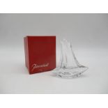 A Daum clear glass paperweight, in the form of a masted sailing boat, inscribed 'Daum, France' to