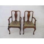 A pair of antique oak carvers on cabriole legs.