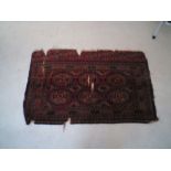 A red ground Eastern rug- A/F