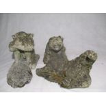 A assortment of small weathered garden ornaments in the form of an elephant, a hedgehog, a pig and a