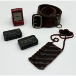 A collection of items including a Sam Brown belt, two Naval Action Ration tins, leather Looping