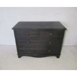 A Victorian ebonised pine chest of drawers, marked 'Trapnell & Gane, Bristol', length 107cm,