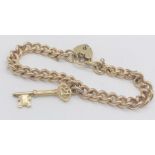 A 9ct gold curb bracelet with padlock- weight 28.5g