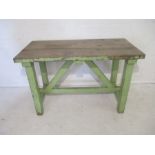 A rustic part-painted garden table/work bench