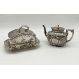 A silver plated cheese dish on stand along with a silver plated teapot