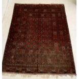 A large Eastern red ground rug