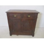A Georgian carved oak dresser base, with two drawers and cupboard beneath, length 101cm, height